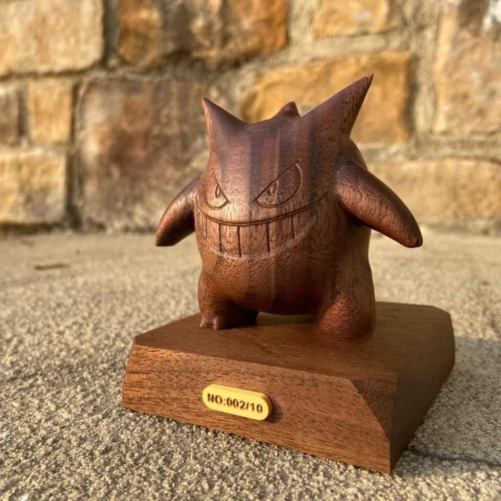 Wooden figurine of a cartoon character on a stone surface with a stone wall background