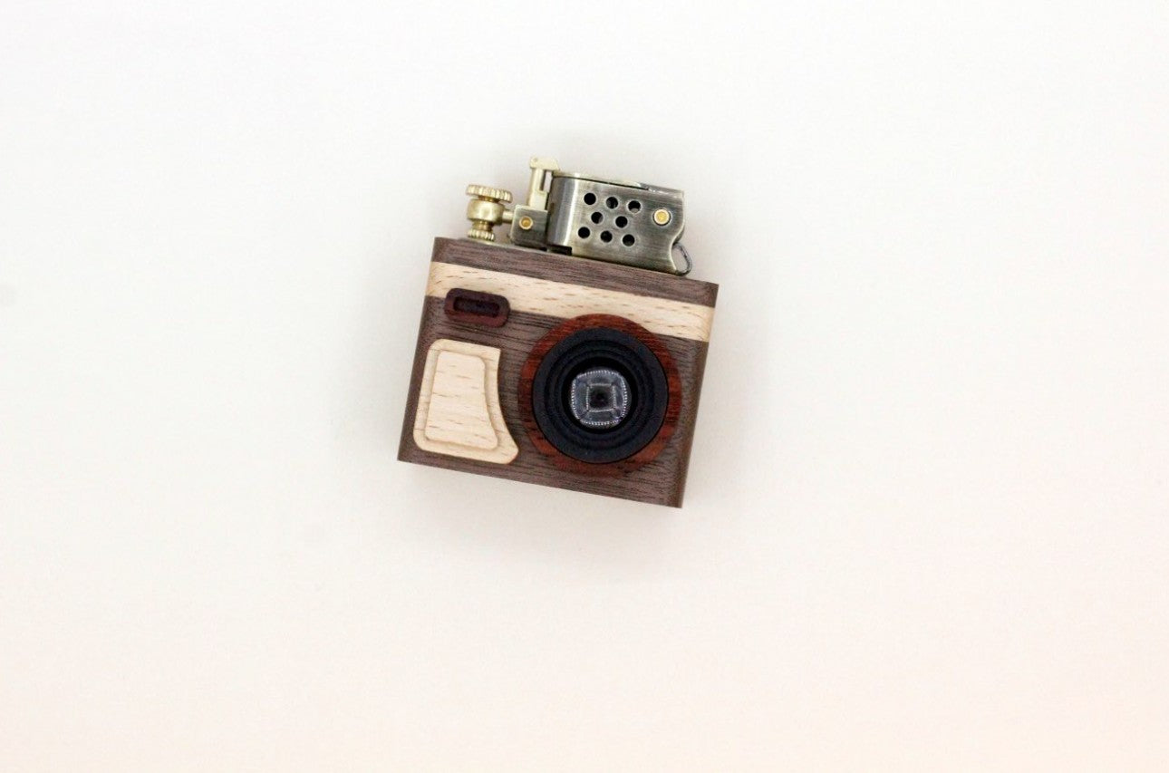 Camera-shaped lighter on a white background