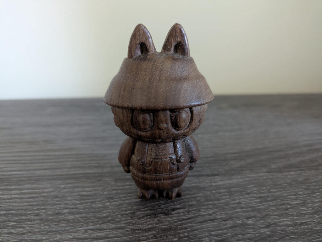 Wooden figurine of a character with large ears
