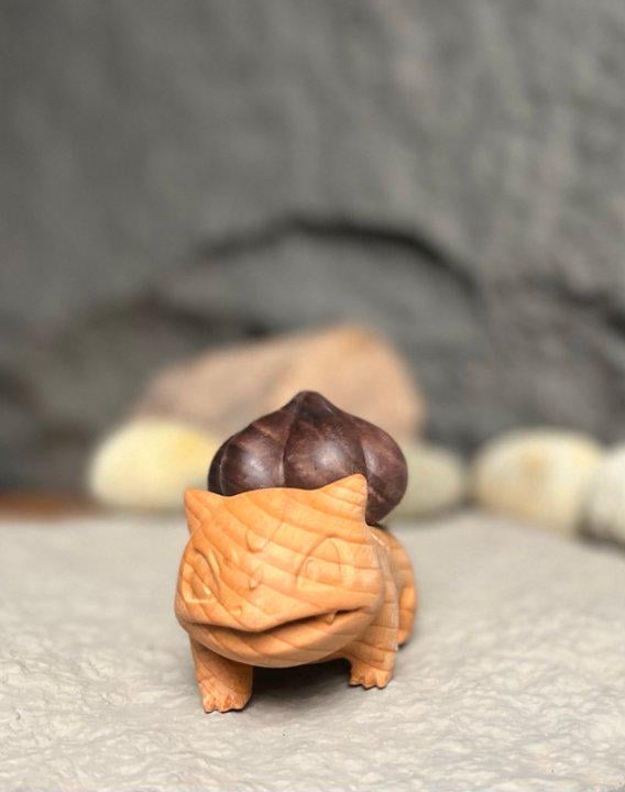 Small figurine of a tortoise with a chestnut on its back