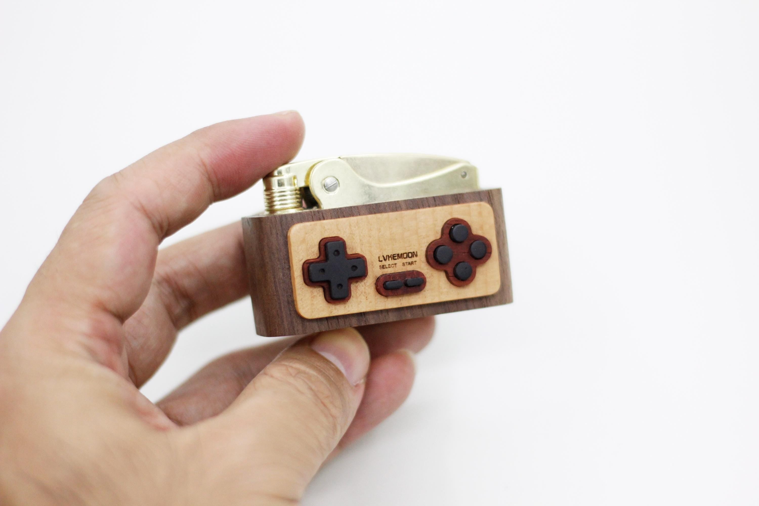  a wooden controller-shaped lighter 