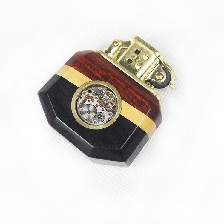 Decorative lighter with wooden and metallic design on a white background