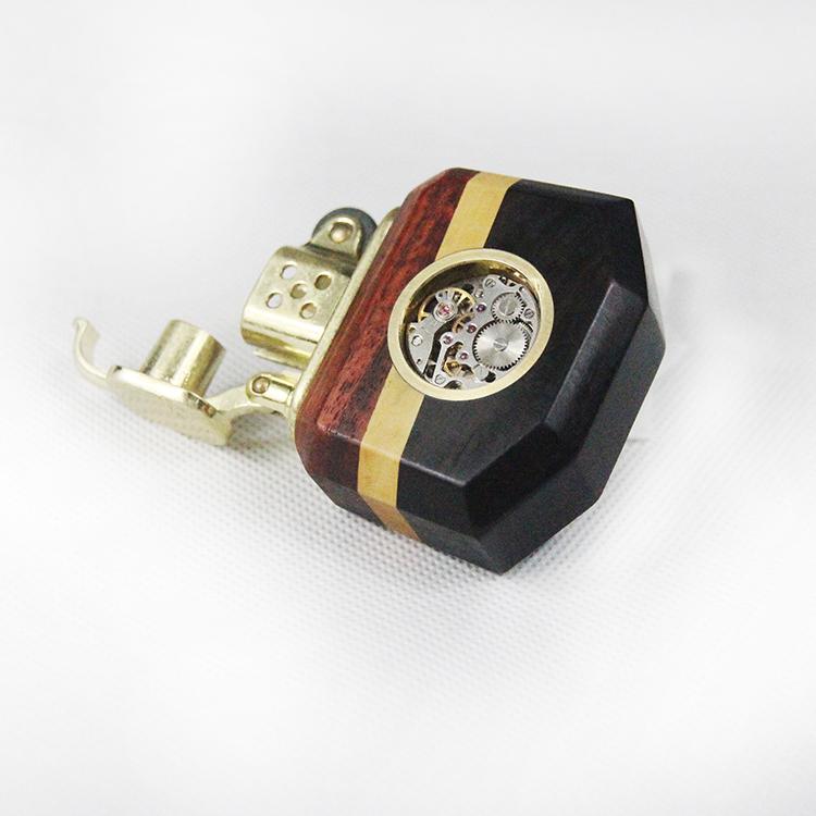 Decorative lighter with wooden and gold accents on a white background