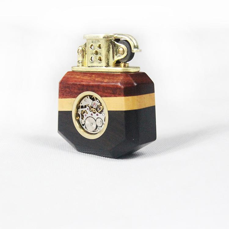 Decorative lighter with wooden and metallic design on a white background