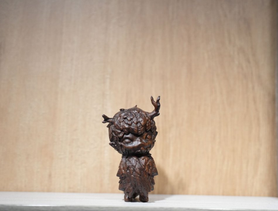 Horn-Shaped With Childlike Feather Figure