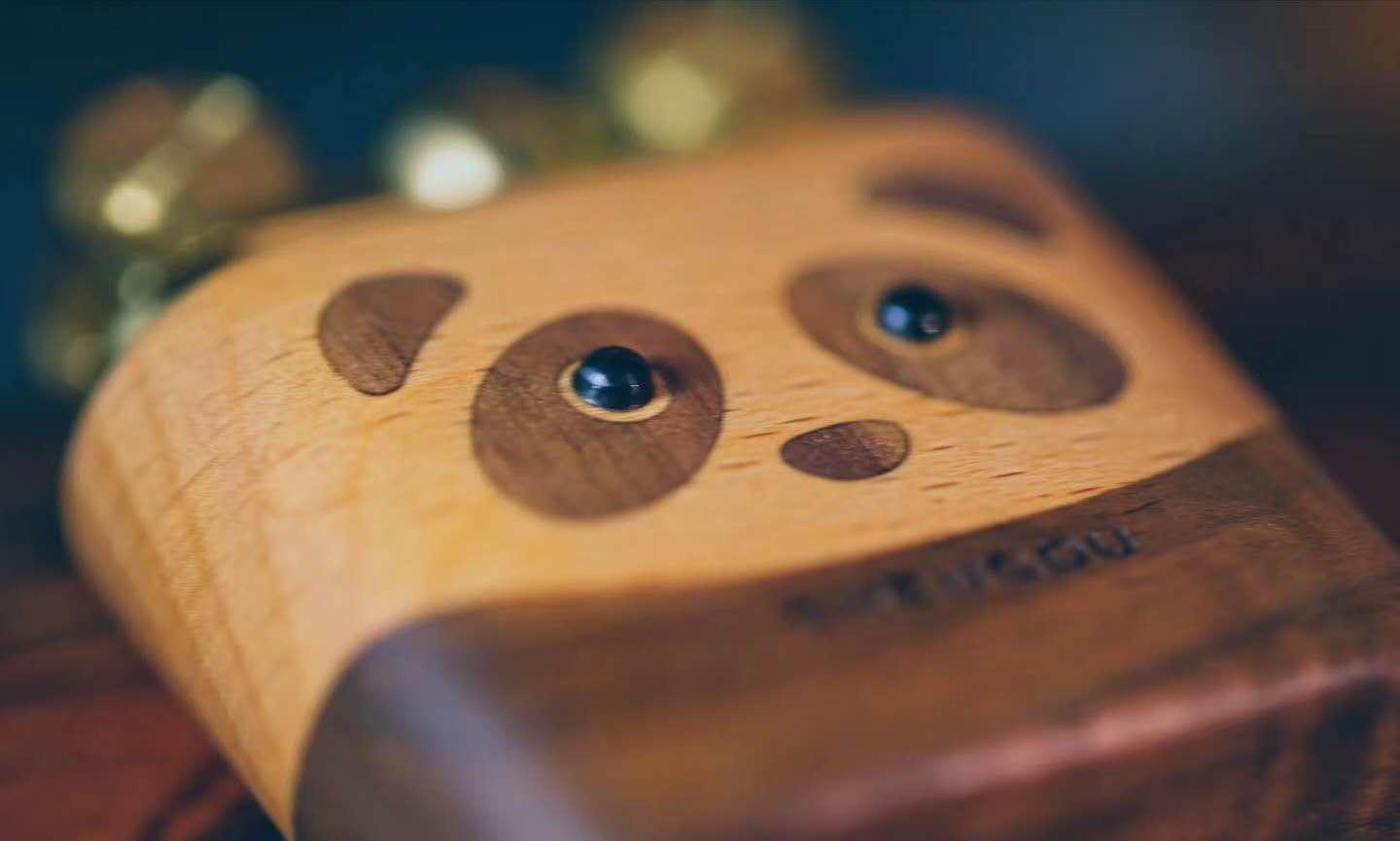 Wooden lighter with a panda face design 
