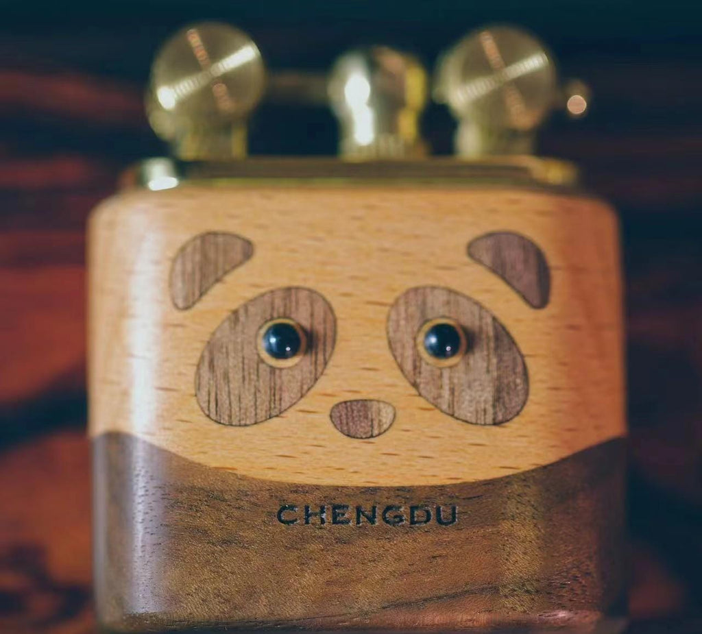 Wooden panda-shaped lighter with 'Chengdu' branding 
